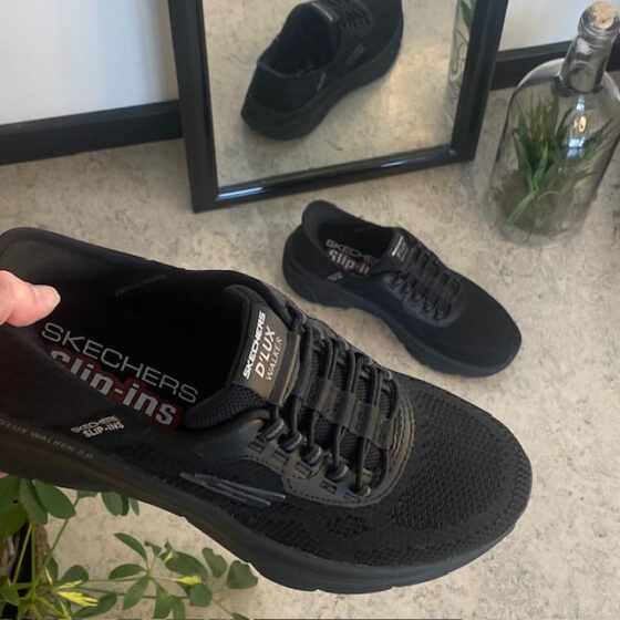 Svarta Skechers Slip-Ins med stretchöverdel
